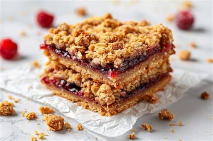 Stack of two berry crumble bars.