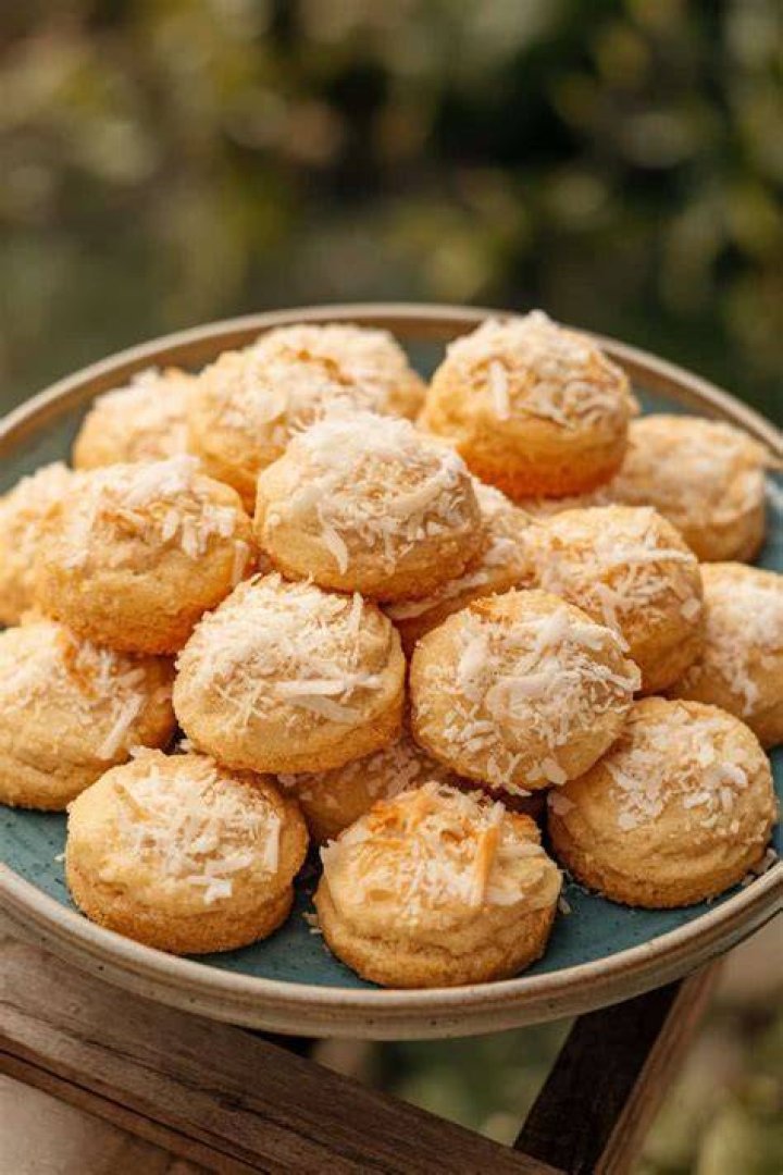 Sugar cookies topped with coconut and egg shaped candies. 